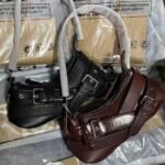 Women's Moto-Style Faux Leather Crescent Shoulder Bag with Buckle